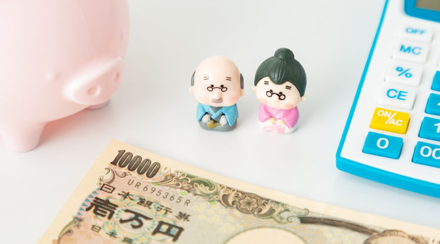 老夫婦の人形と一万円札